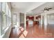 Spacious living room with hardwood floors and views into kitchen at 8513 Garden View Dr, Charlotte, NC 28277