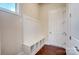 Functional mudroom featuring hardwood floors, storage bench, and coat hooks at 8513 Garden View Dr, Charlotte, NC 28277