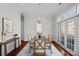 Elegant dining room featuring a stylish chandelier and French doors leading to the outdoors at 8812 Provence Village Ln, Charlotte, NC 28226