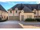 Elegant two-story home with a dual-car garage and appealing architectural details and well-maintained landscaping at 8812 Provence Village Ln, Charlotte, NC 28226