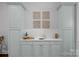 Convenient kitchenette with custom cabinets, ample counter space, and decorative wall art at 8812 Provence Village Ln, Charlotte, NC 28226