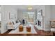 Cozy living room featuring a fireplace, plush seating, and access to a charming outdoor patio at 8812 Provence Village Ln, Charlotte, NC 28226