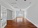 Spacious living room with hardwood floors, white trim and plenty of natural light at 8812 Provence Village Ln, Charlotte, NC 28226