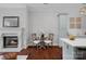 Cozy seating area near the fireplace and gourmet kitchen, perfect for casual dining and entertaining at 8812 Provence Village Ln, Charlotte, NC 28226