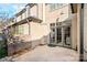 Home's patio featuring a brick wall and glass doors at 8812 Provence Village Ln, Charlotte, NC 28226