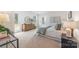 Cozy bedroom with ample natural light, walk-out to the backyard, and neutral decor at 9239 Delancey Nw Ln, Concord, NC 28027