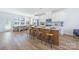 Open-concept kitchen with large island and stainless steel appliances flows into a dining area at 9239 Delancey Nw Ln, Concord, NC 28027