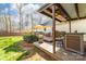 Relaxing deck area with grilling station, dining area and outdoor seating. Perfect for backyard gatherings at 1025 Hunter Valley Rd, Shelby, NC 28150