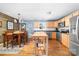 Bright kitchen with stainless steel appliances, wood cabinets, and island, ready for your culinary creations at 1025 Hunter Valley Rd, Shelby, NC 28150