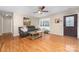 Open-concept living room features hardwood floors and lots of natural light from the large front window at 1025 Hunter Valley Rd, Shelby, NC 28150