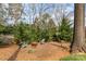 Cozy backyard featuring a fire pit and comfortable seating for outdoor gatherings at 10332 Hollybrook Dr, Charlotte, NC 28277