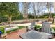 Spacious backyard with patio, lush greenery, and play areas for outdoor enjoyment at 10332 Hollybrook Dr, Charlotte, NC 28277