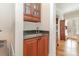 Wet bar area featuring granite counters and ample storage at 10332 Hollybrook Dr, Charlotte, NC 28277