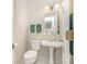 Small bathroom with pedestal sink, light fixtures, and white tile floors at 10332 Hollybrook Dr, Charlotte, NC 28277