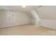 Empty bedroom with a dormer, and neutral carpet at 10332 Hollybrook Dr, Charlotte, NC 28277