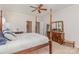 A bedroom with a four poster bed, neutral carpet, and a view into the ensuite bathroom at 10332 Hollybrook Dr, Charlotte, NC 28277