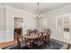 Spacious dining room illuminated with natural light and classic finishes at 10332 Hollybrook Dr, Charlotte, NC 28277