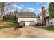 Detached garage with ample parking space and a well-maintained backyard at 10332 Hollybrook Dr, Charlotte, NC 28277