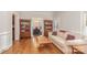 Open living area with hardwood floors, comfortable seating, and view into the dining room at 10332 Hollybrook Dr, Charlotte, NC 28277