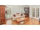 Cozy living room with hardwood floors, neutral sofa, coffee table, and natural light at 10332 Hollybrook Dr, Charlotte, NC 28277