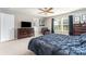 Large bedroom featuring a ceiling fan, carpeted floor, and a large window at 1037 Delridge St, Waxhaw, NC 28173