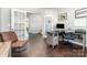 Spacious home office with hardwood floors, ample workspace, and elegant French door entry at 1037 Delridge St, Waxhaw, NC 28173
