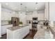 Modern kitchen with stainless steel appliances, granite countertops, and a functional kitchen island at 1037 Delridge St, Waxhaw, NC 28173