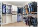 Walk-in closet with custom shelving and ample storage space for organization at 1037 Delridge St, Waxhaw, NC 28173