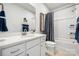 A well-lit bathroom with stylish fixtures, white cabinets, and a tub-shower combo at 1048 Arundle Rd, Sherrills Ford, NC 28673
