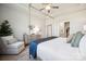 A calming bedroom featuring neutral tones, with an ensuite bathroom, and a plush armchair at 1048 Arundle Rd, Sherrills Ford, NC 28673