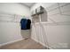 Walk-in closet with ample shelving, metal racks, and overhead storage space at 1048 Arundle Rd, Sherrills Ford, NC 28673