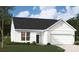 Charming single-story home featuring white siding, a black roof, and an attached two-car garage at 1048 Arundle Rd, Sherrills Ford, NC 28673