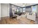 Well-decorated living room with contemporary furniture, a television, and wood-look floors at 1048 Arundle Rd, Sherrills Ford, NC 28673