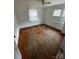 Bedroom with wood floors, natural light and two windows at 10516 Hambright Rd, Huntersville, NC 28078