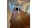 Spacious living room with gleaming hardwood floors and a cozy fireplace at 10516 Hambright Rd, Huntersville, NC 28078