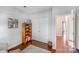Charming bedroom featuring warm wood floors and a double door closet, complemented by a stylish bookshelf at 11003 Pale Hickory Ln, Charlotte, NC 28215
