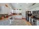 Spacious kitchen featuring granite countertops, a breakfast bar, and stainless appliances at 11003 Pale Hickory Ln, Charlotte, NC 28215