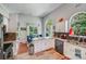 Bright kitchen with granite counters, stainless steel appliances and large window to the outside seating area at 11003 Pale Hickory Ln, Charlotte, NC 28215