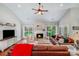 Inviting living room features a fireplace, wood floors, large windows, and a vaulted ceiling at 11003 Pale Hickory Ln, Charlotte, NC 28215