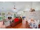 Inviting living room with a fireplace, vaulted ceilings, and a dining area at 11003 Pale Hickory Ln, Charlotte, NC 28215