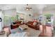 Open living room with wood floors, a high ceiling, and a view to the kitchen and dining area at 11003 Pale Hickory Ln, Charlotte, NC 28215