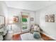 Cozy living area with a large window view and hardwood floors at 11003 Pale Hickory Ln, Charlotte, NC 28215