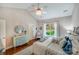 Light-filled bedroom with vaulted ceiling, chandelier, and scenic backyard view at 11003 Pale Hickory Ln, Charlotte, NC 28215