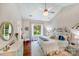Serene bedroom with vaulted ceiling, chandelier, and scenic backyard view at 11003 Pale Hickory Ln, Charlotte, NC 28215