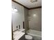 Compact bathroom featuring a vanity sink, toilet, and a tub with shower head at 112 S Hill Ave, Albemarle, NC 28001