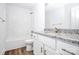 Bathroom features a shower, toilet, and granite countertop sink at 1235 E Poplar St, Conover, NC 28613