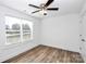 Bright bedroom with a ceiling fan, natural light from a window, and stylish wood floors at 1235 E Poplar St, Conover, NC 28613