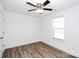 Bright bedroom with hardwood floors, white walls, and ceiling fan at 1235 E Poplar St, Conover, NC 28613