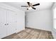 Bright bedroom with a ceiling fan, natural light from a window, and stylish wood floors at 1235 E Poplar St, Conover, NC 28613