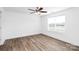 Bright bedroom with hardwood floors, white walls, and ceiling fan at 1235 E Poplar St, Conover, NC 28613